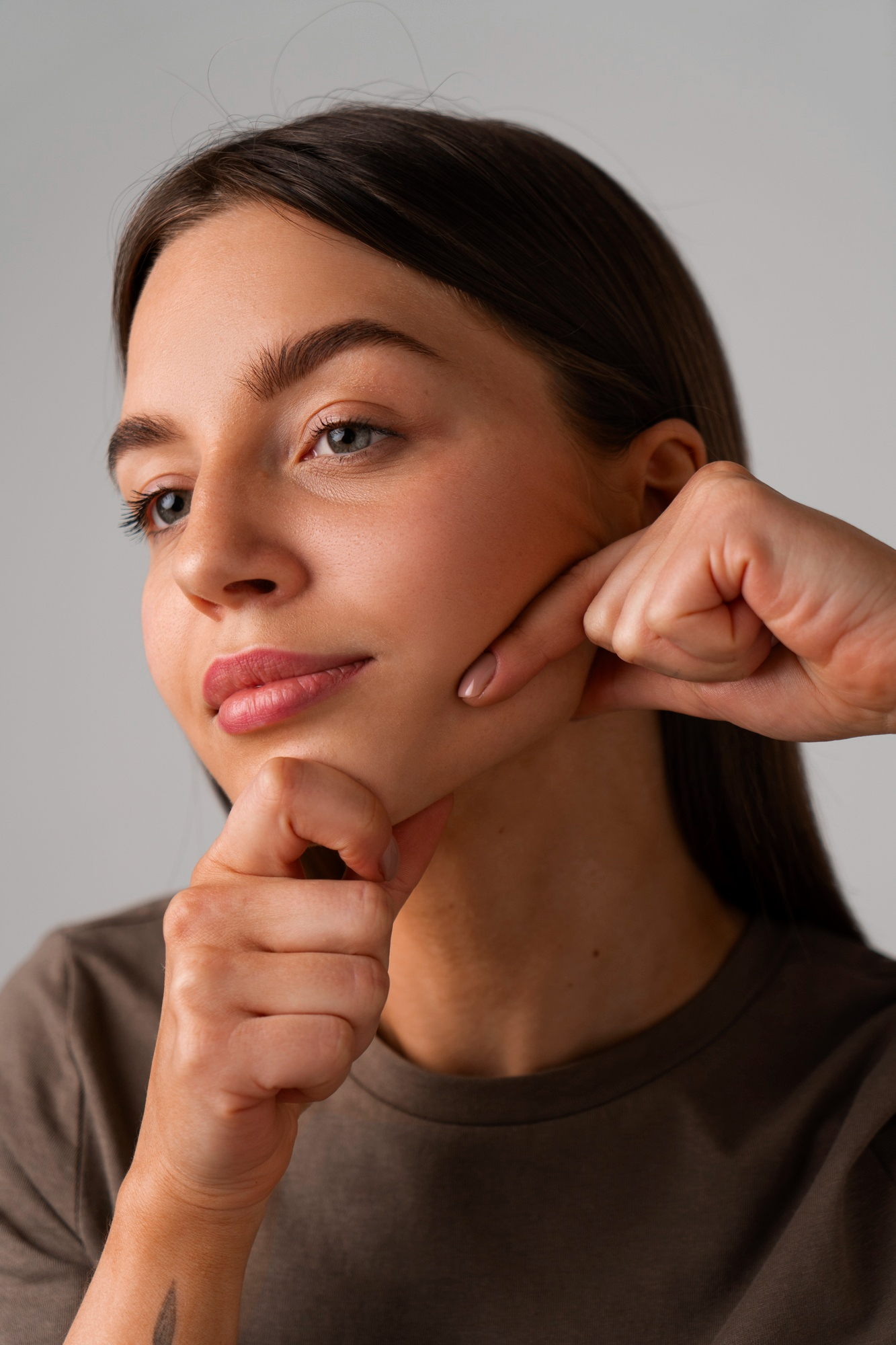 side-view-woman-practicing-facial-yoga